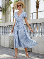 Load image into Gallery viewer, Bell Sleeve Ruffle Hem Ditsy Floral Maxi Dress
